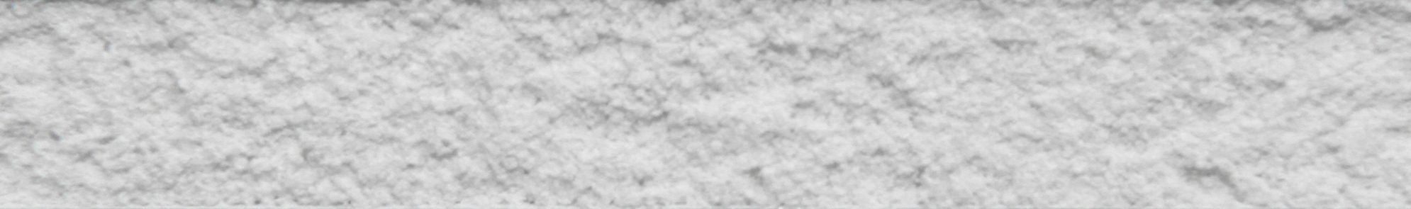 Close-up texture of Workrite Arctic white cement finish showing rough surface detail